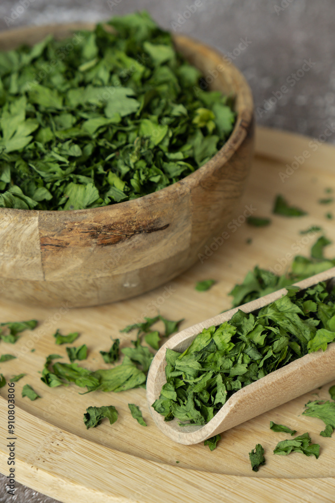 Wooden bowl with green dry parsley. Vegetarian bio organic salad herb healthy eating. Home garden immunity-boosting herbs. Seasonal harvest cottagecore Wooden bowl with green dry parsley. Vegetarian bio organic salad herb healthy eating. Home garden immunity-boosting herbs. Seasonal harvest cottagecore