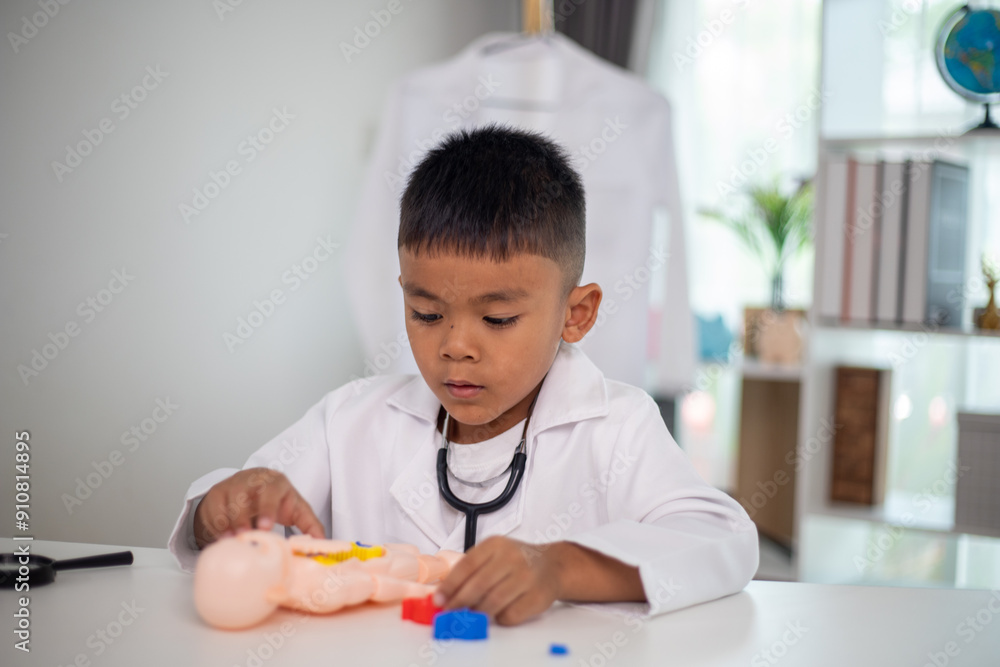 A young boy is playing with a doll in a doctor's office A young boy is playing with a doll in a doctor's office
