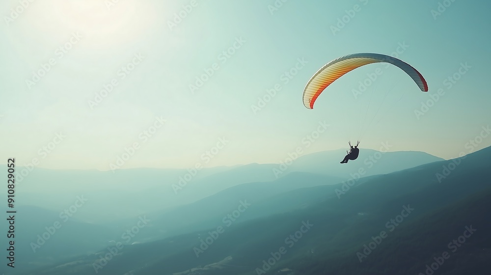 Paraglider Soaring Above Mountain Range Paraglider Soaring Above Mountain Range