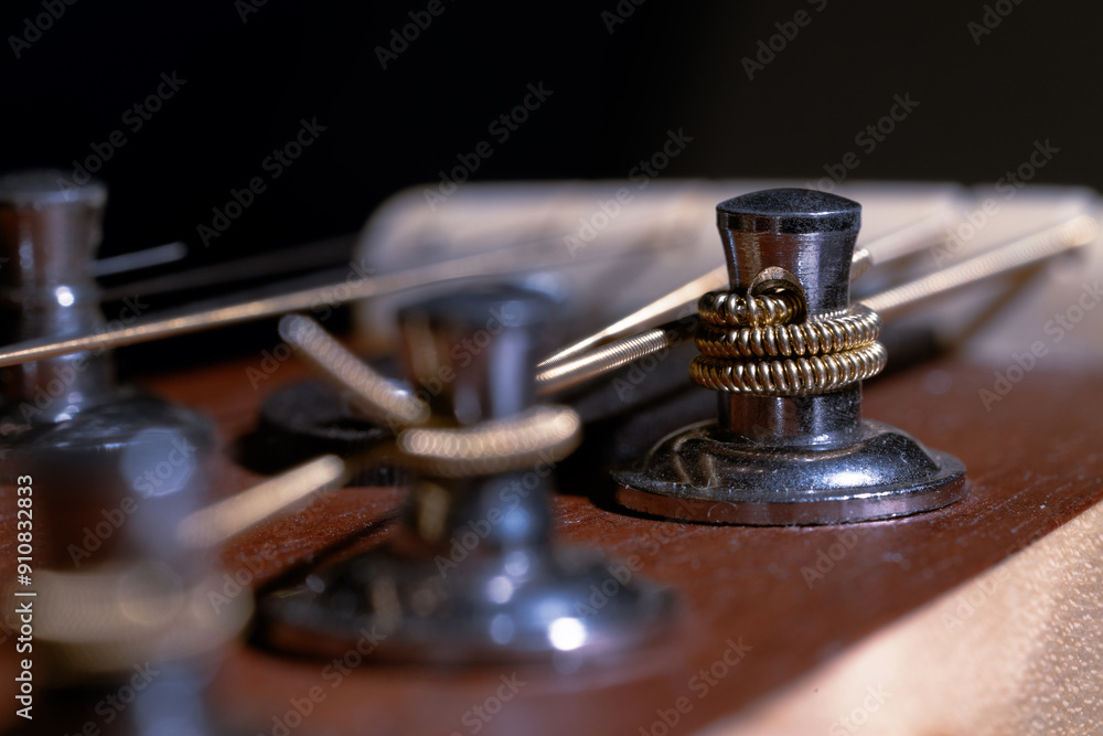 classical guitar peg metallic string around macro photography of old vintage musical instrument tool focus on background with blurred foreground classical guitar peg metallic string around macro photography of old vintage musical instrument tool focus on background with blurred foreground