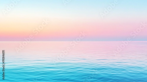 Serene ocean at dusk with soft pastel hues of pink and blue reflecting on calm water surface, creating a peaceful atmosphere.