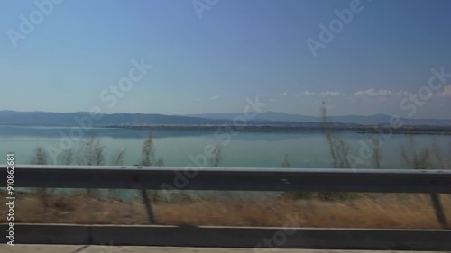 Driving by Lake Volvi in Greece photo