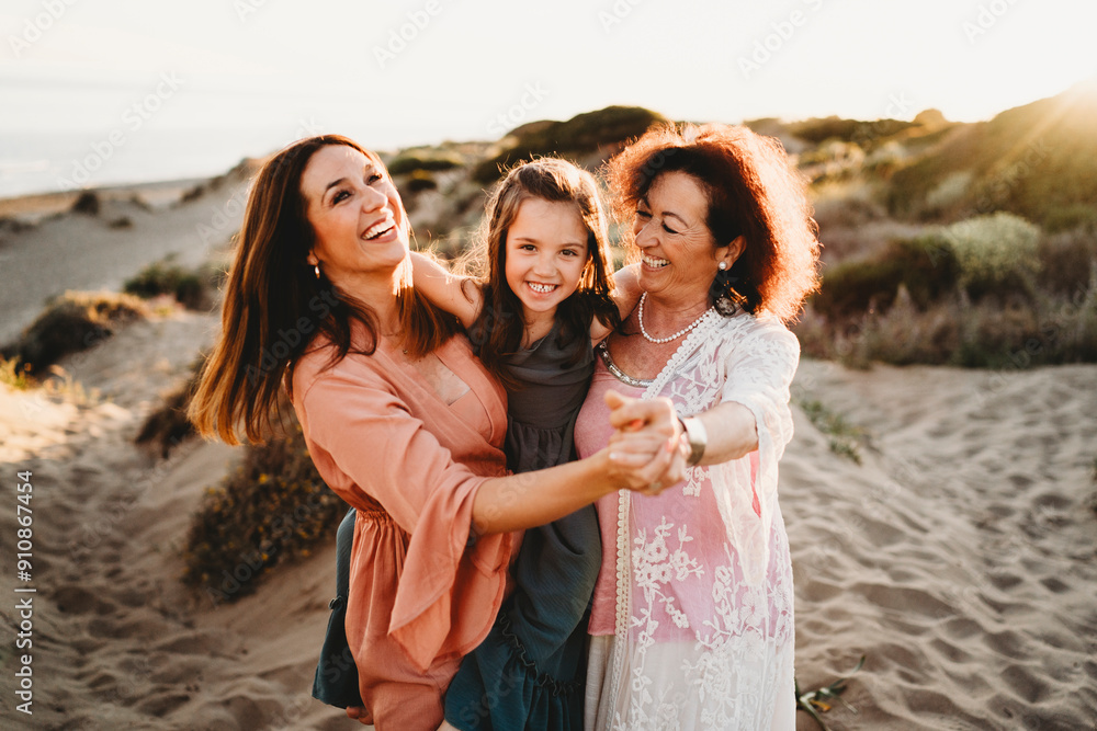 Happy white girl mom grandma laughing dancing beach sunset Spain Happy white girl mom grandma laughing dancing beach sunset Spain