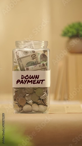 VERTICAL VIDEO OF PERSON SAVING MONEY FOR DOWN PAYMENT