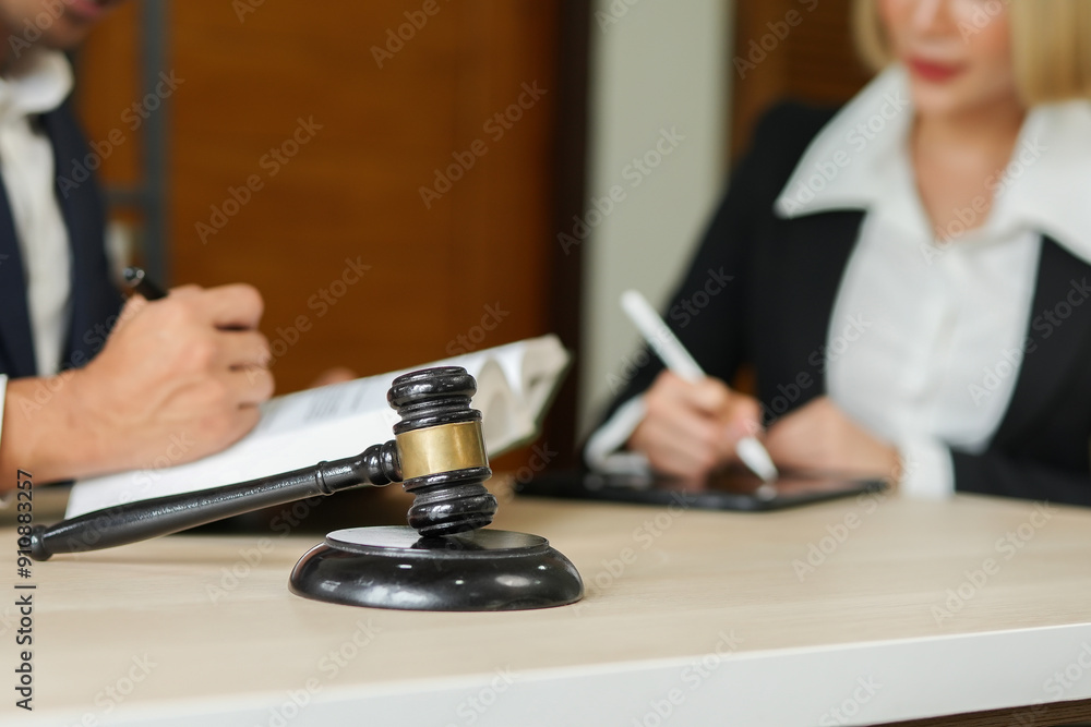 judge on wooden table And experienced lawyers meet with clients and give advice behind the scenes. legal services legal consulting concept judge on wooden table And experienced lawyers meet with clients and give advice behind the scenes. legal services legal consulting concept
