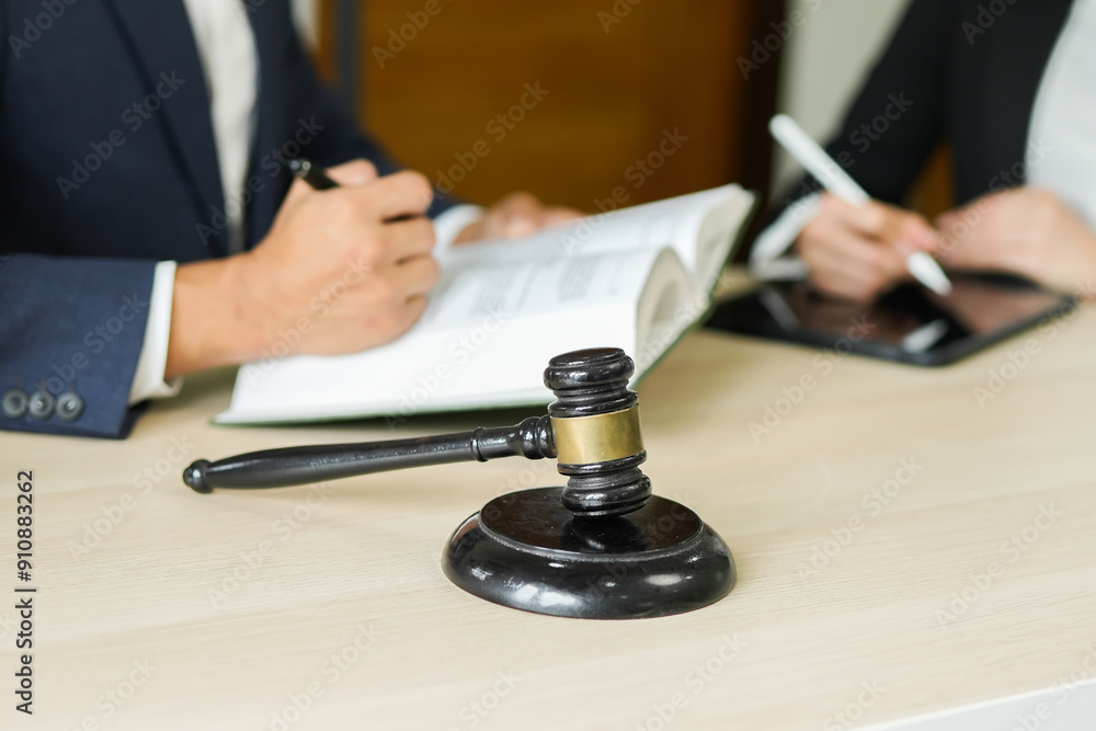 judge on wooden table And experienced lawyers meet with clients and give advice behind the scenes. legal services legal consulting concept judge on wooden table And experienced lawyers meet with clients and give advice behind the scenes. legal services legal consulting concept