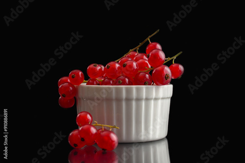 Red currants inside a white container