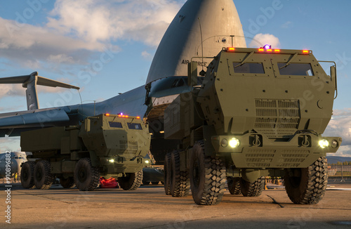 Obraz na płótnie High mobility artillery rocket system transported aboard a transport aircraft w salonie
