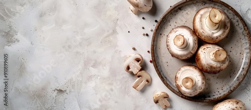 A rustic top view image of a champignon slice on a plate set on a table with a copy space food background showcases a delightful mushroom snack or meal