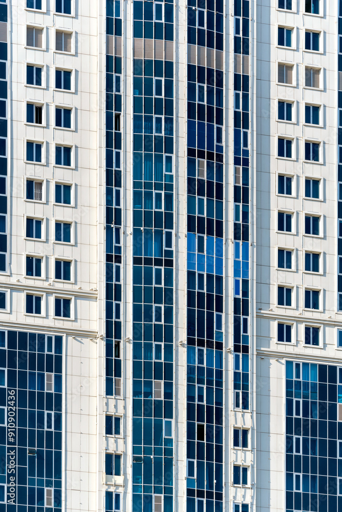 many windows and walls facade of a modern skyscraper without people many windows and walls facade of a modern skyscraper without people