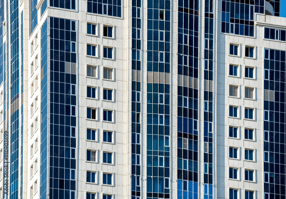 many windows and walls facade of a modern skyscraper without people many windows and walls facade of a modern skyscraper without people