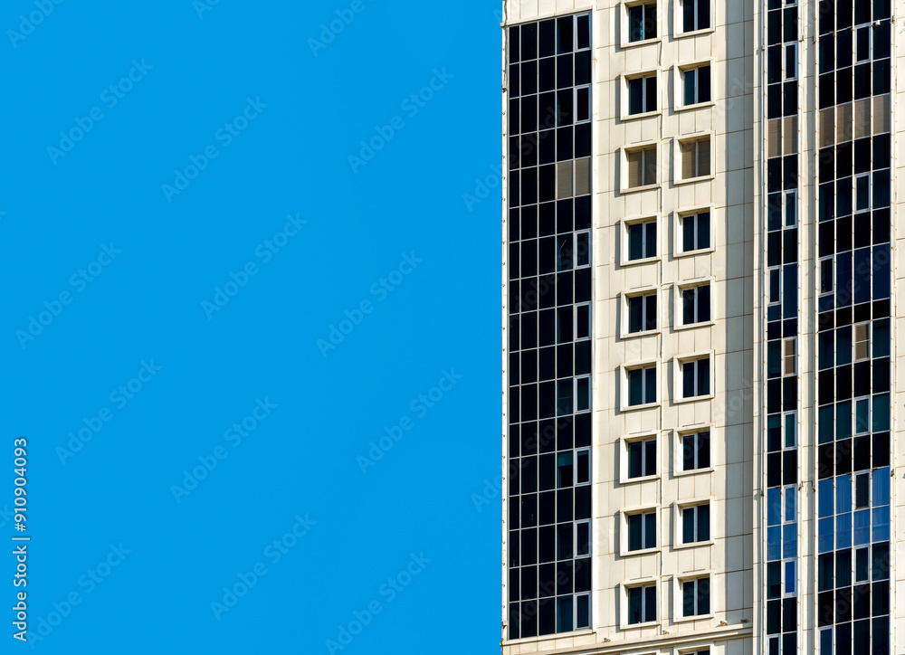 many windows and walls facade of a modern skyscraper without people many windows and walls facade of a modern skyscraper without people