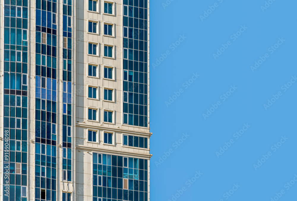 many windows and walls facade of a modern skyscraper without people many windows and walls facade of a modern skyscraper without people