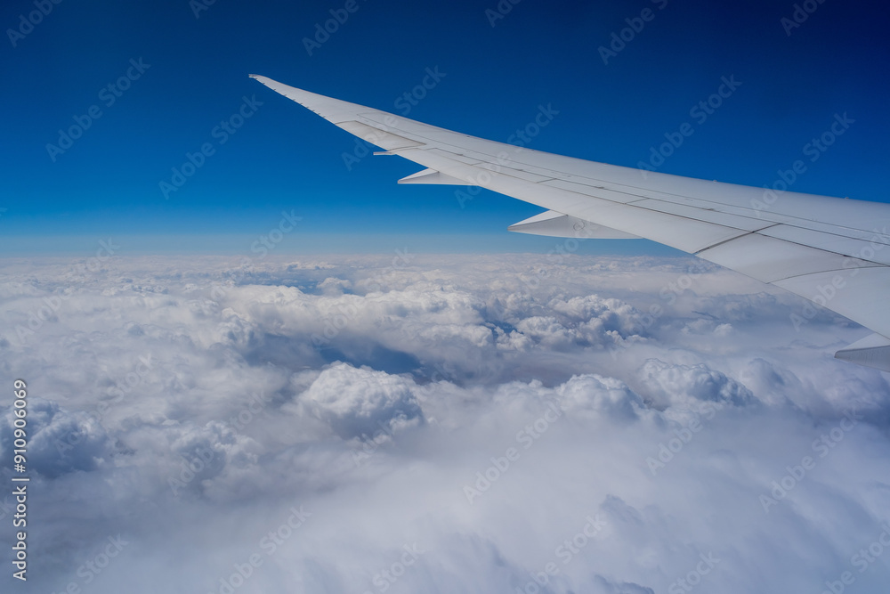 View from an airplane on a blue sky and white clouds View from an airplane on a blue sky and white clouds