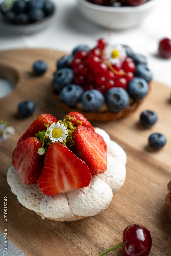Berry Desserts Assortment, Seasonal Pastry over Bright Background Berry Desserts Assortment, Seasonal Pastry over Bright Background