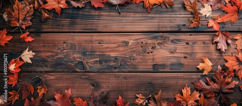 Obraz na płótnie Top down view of a rustic wooden table adorned with vibrant fall leaves perfect for Thanksgiving or autumn themed compositions with plenty of room for text or images. Creative banner. Copyspace image w salonie