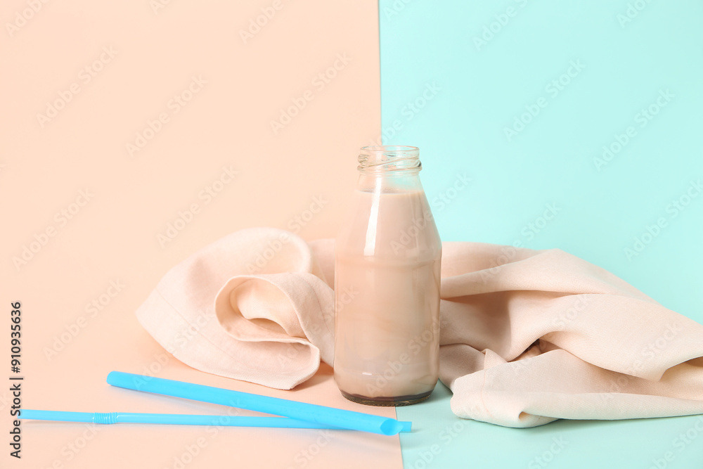 Bottle of sweet chocolate milk on colorful background Bottle of sweet chocolate milk on colorful background