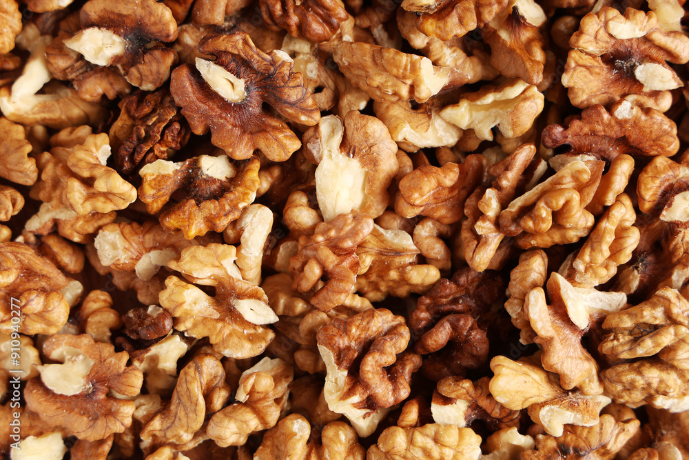 Texture of tasty peeled walnuts as background Texture of tasty peeled walnuts as background