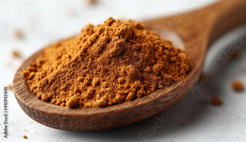 Wooden spoon with powder on white background, isolated photo of food. wooden spoon full wood grain texture with dry beige color turmeric powder, isolated photo of natural health product. A macro close