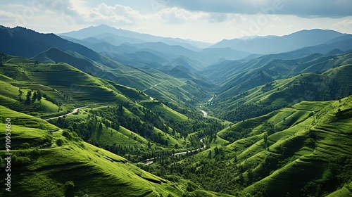 a green valley with a river running through it.