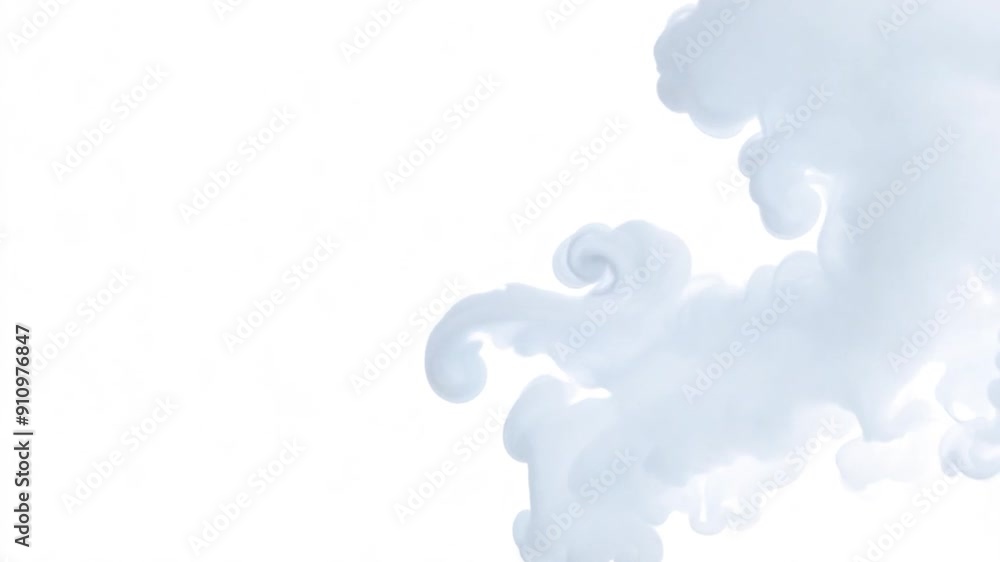 Wispy white clouds float softly across a bright blue sky, creating a peaceful and tranquil atmosphere in the afternoon light