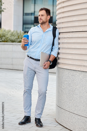 A man dressed respectably walks around the city during a break in the office photo