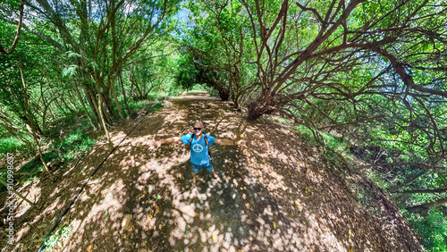 A hike at the Hawaiian forest nearby the kawela forest with the banyan tree photo