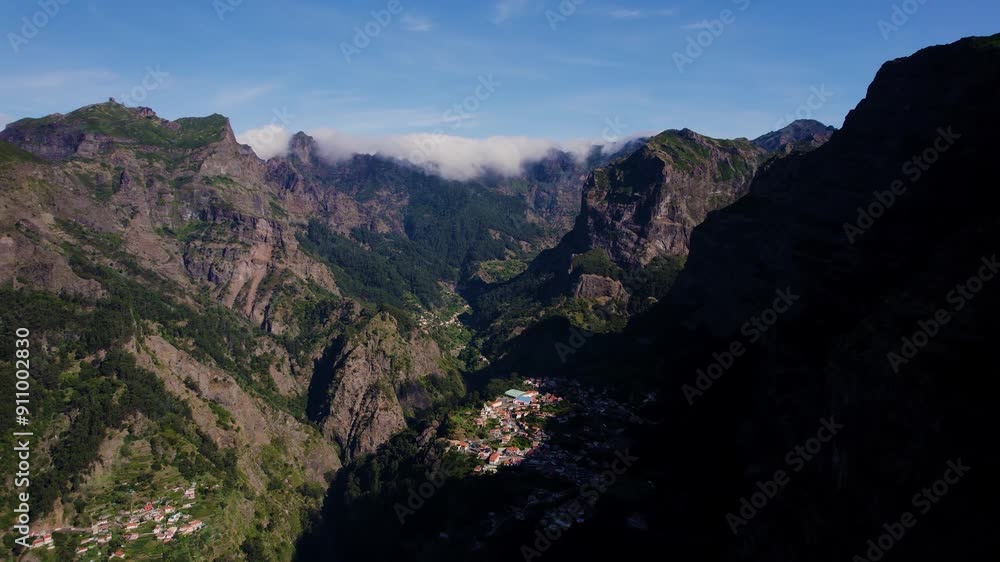 Aerial view of a small town in the middle of mountain range. Madeira landscape. Aerial view of a small town in the middle of mountain range. Madeira landscape.