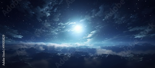 Nighttime View of Mountain Range with Starry Sky and Fog