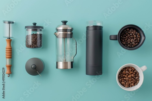 Collection of various coffee-making tools including French press, grinder, and coffee beans arranged on a smooth turquoise background, showcasing modern design and functionality. photo