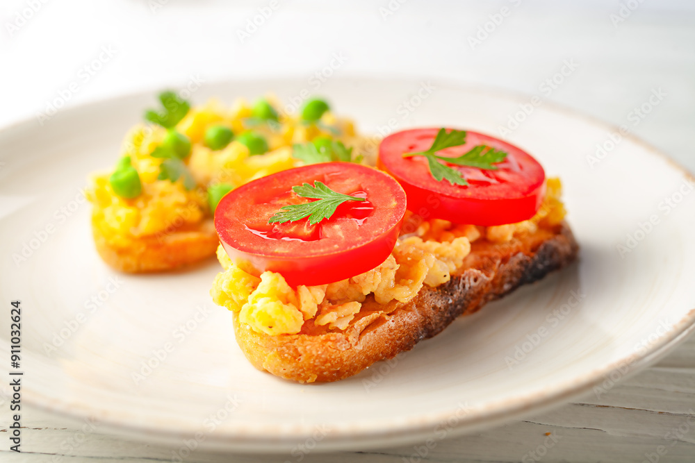 Scrambled eggs on toast, side view. Homemade breakfast - sandwiches with fried eggs. Scrambled eggs on toast, side view. Homemade breakfast - sandwiches with fried eggs.