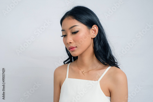 Look Down Beautiful Asian Woman with Tan Skin in White Dress on White Background