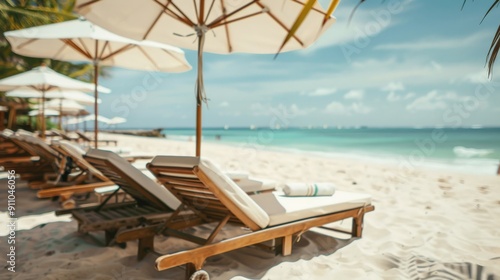 A beautiful sunny day on a tropical beach featuring wooden loungers arranged under umbrellas on the white sandy shore, with the turquoise sea stretching into the horizon.