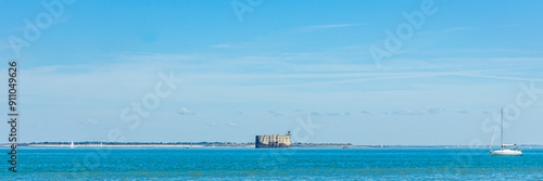 Fort boyard seen from Boyardville beach on a sunny day in Charente-Maritime, France photo