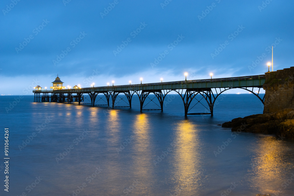 The Grade 1 listed 'Cleveland Pier' in the Bristol Channel illuminated at dusk