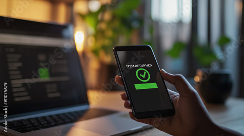 Item returned confirmation on smartphone. Digital return process, online shopping, e-commerce transaction, secure confirmation