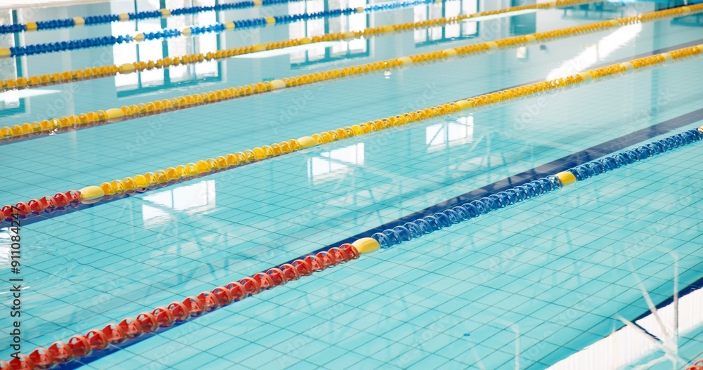 Obraz premium Swimming pool, empty and lines with game, fitness and water for sports, cardio workout and lanes. Competition, blue and swim training arena ready for race performance, dividers and exercise challenge