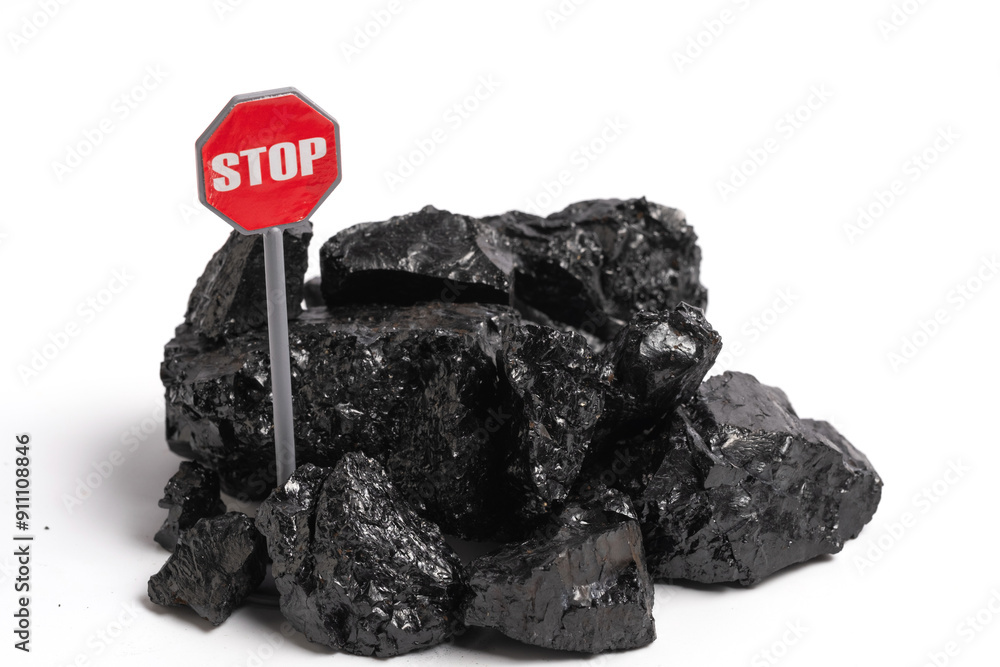 Obraz premium Pile of coal with stop sign isolated on a white background.