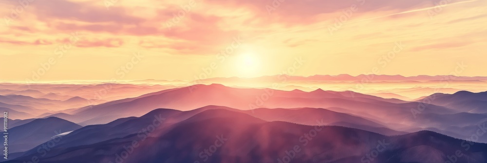 Obraz premium Dreamy dawn light spreading over layers of mountains, casting a hazy effect and showcasing the tranquil and mystical beauty of the landscape.