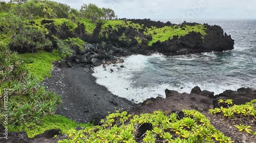 Cove on Black Sand Beach from the Road to Hana in Maui Hawaii Timelapse hyperlapse. photo