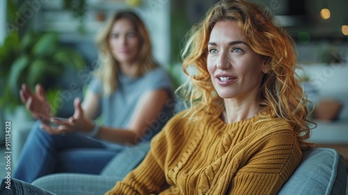 Two Women Engaged in an Intimate Conversation at Home on a Relaxing Afternoon