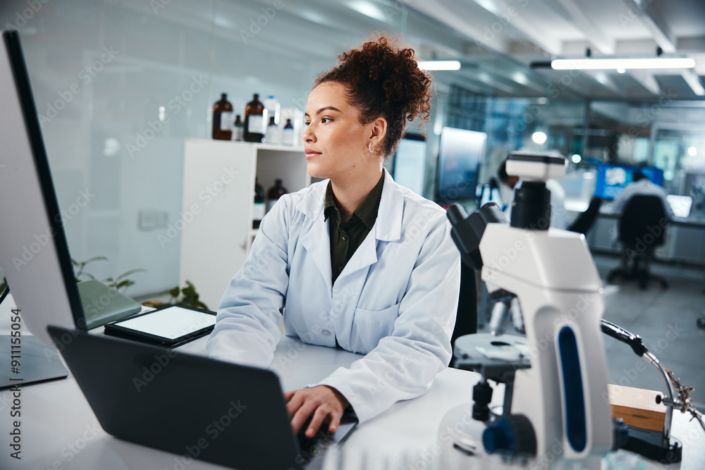 Fototapeta premium Concentration, laptop and science with woman in laboratory for development, innovation or research. Computer, pharmaceuticals and typing with serious scientist at work on breakthrough or discovery