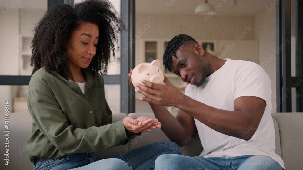 African American couple sad upset poor family husband wife shaking empty piggy bank at home economy budget savings financial crisis money problem bankruptcy destitution credit disappointed woman man African American couple sad upset poor family husband wife shaking empty piggy bank at home economy budget savings financial crisis money problem bankruptcy destitution credit disappointed woman man