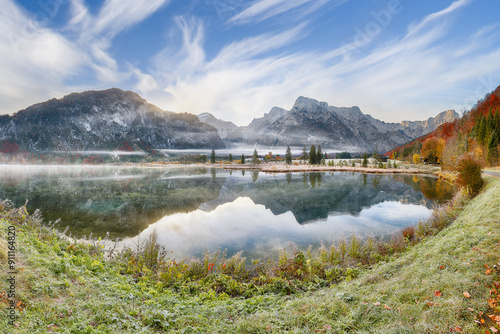 Obraz na płótnie Captivating autumn scene of foggy and sunny morning on Almsee lake. w salonie