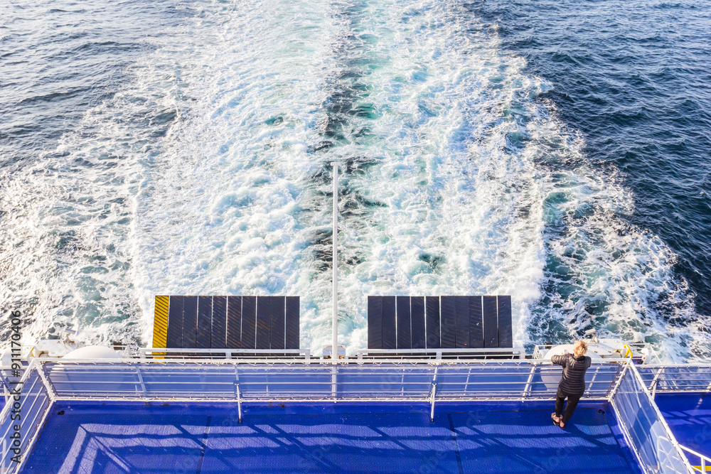 Woman looking out over the North Sea on a ferry between Holland and England
