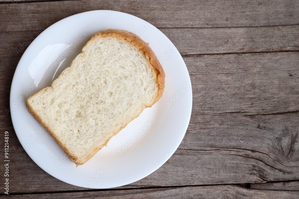 Breakfast of sliced bread on wood background Breakfast of sliced bread on wood background