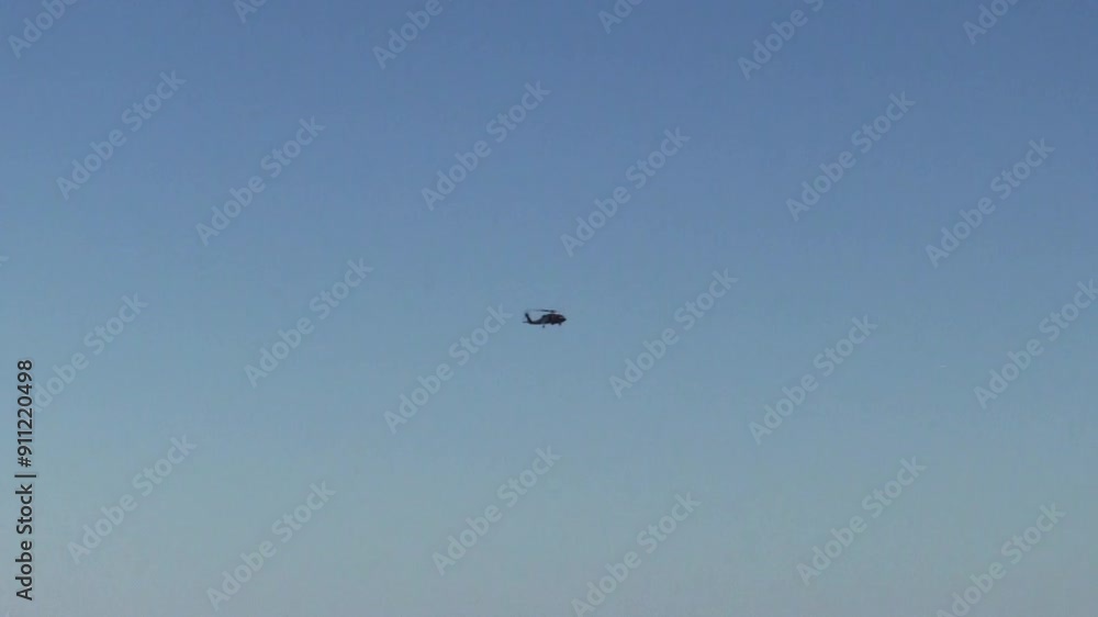 Distant Military Helicopter Flying In Blue Sky Handheld Oceanside California
Distant Military Helicopter Flying In Blue Sky Handheld Oceanside California