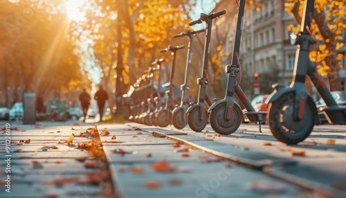 Evening Stroll Through a Park Lined With Shared Electric Scooters and Fall Foliage