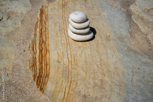 Photography stone stack with white stones on stone slabs