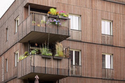Fotografi Wooden Facade of Modern Building Apartments Design